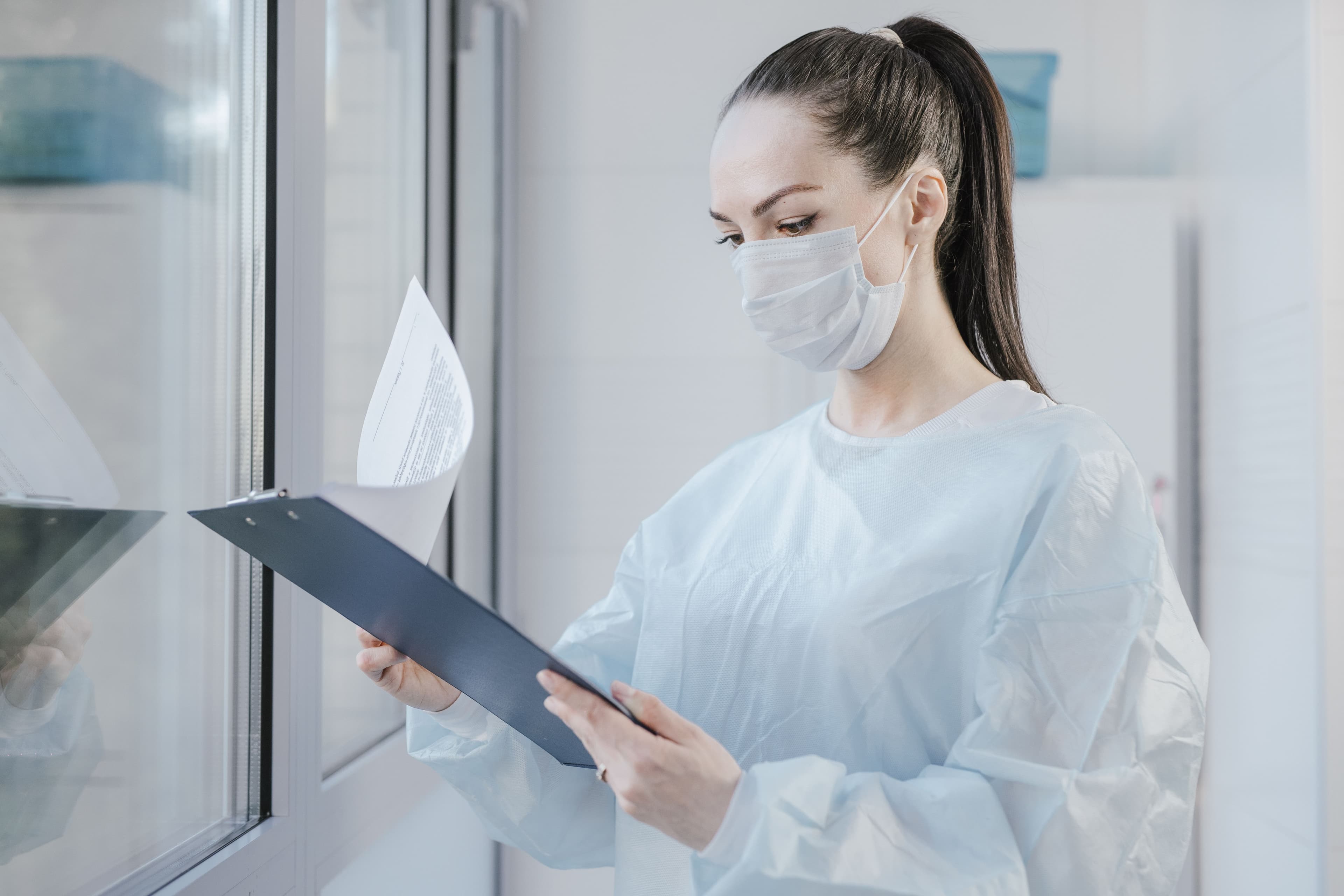 Staff member reviewing a patient's financial record