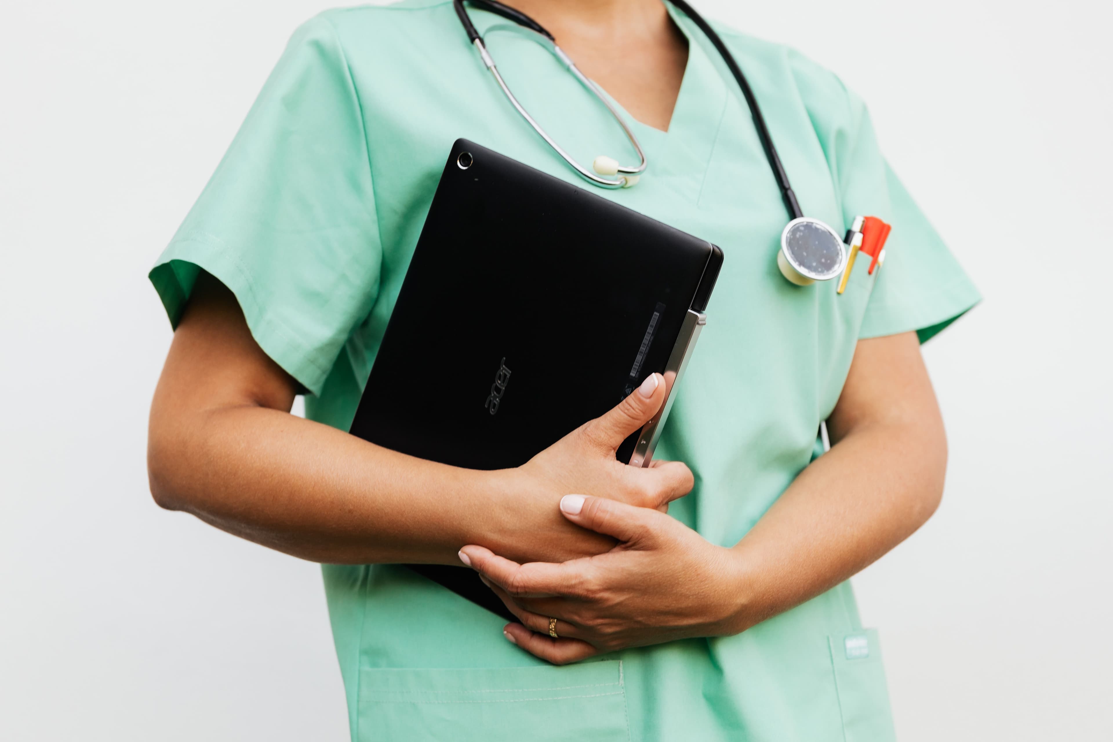 Medical staff member with a digital tablet