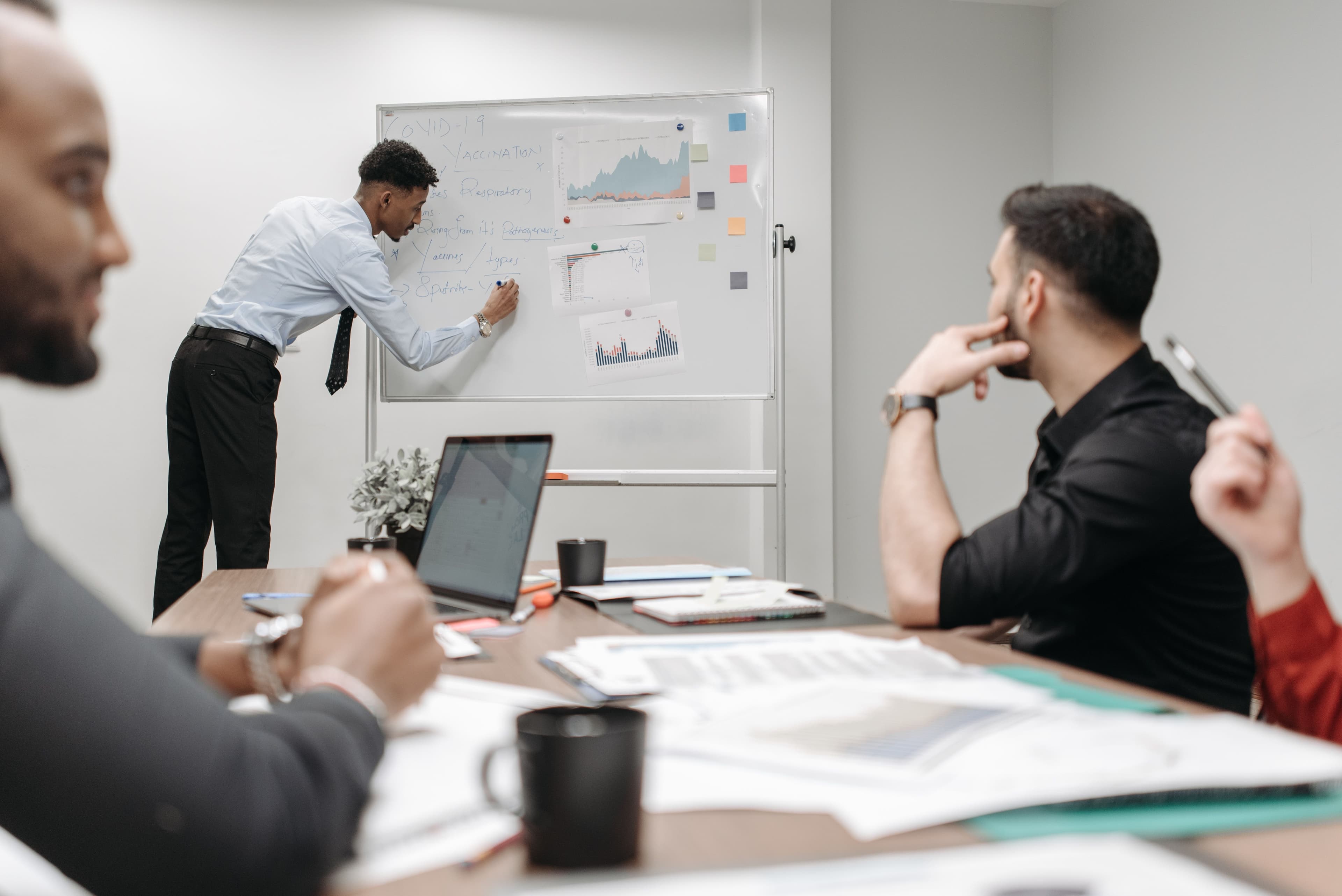 Team of data scientists and business analysts in a meeting
